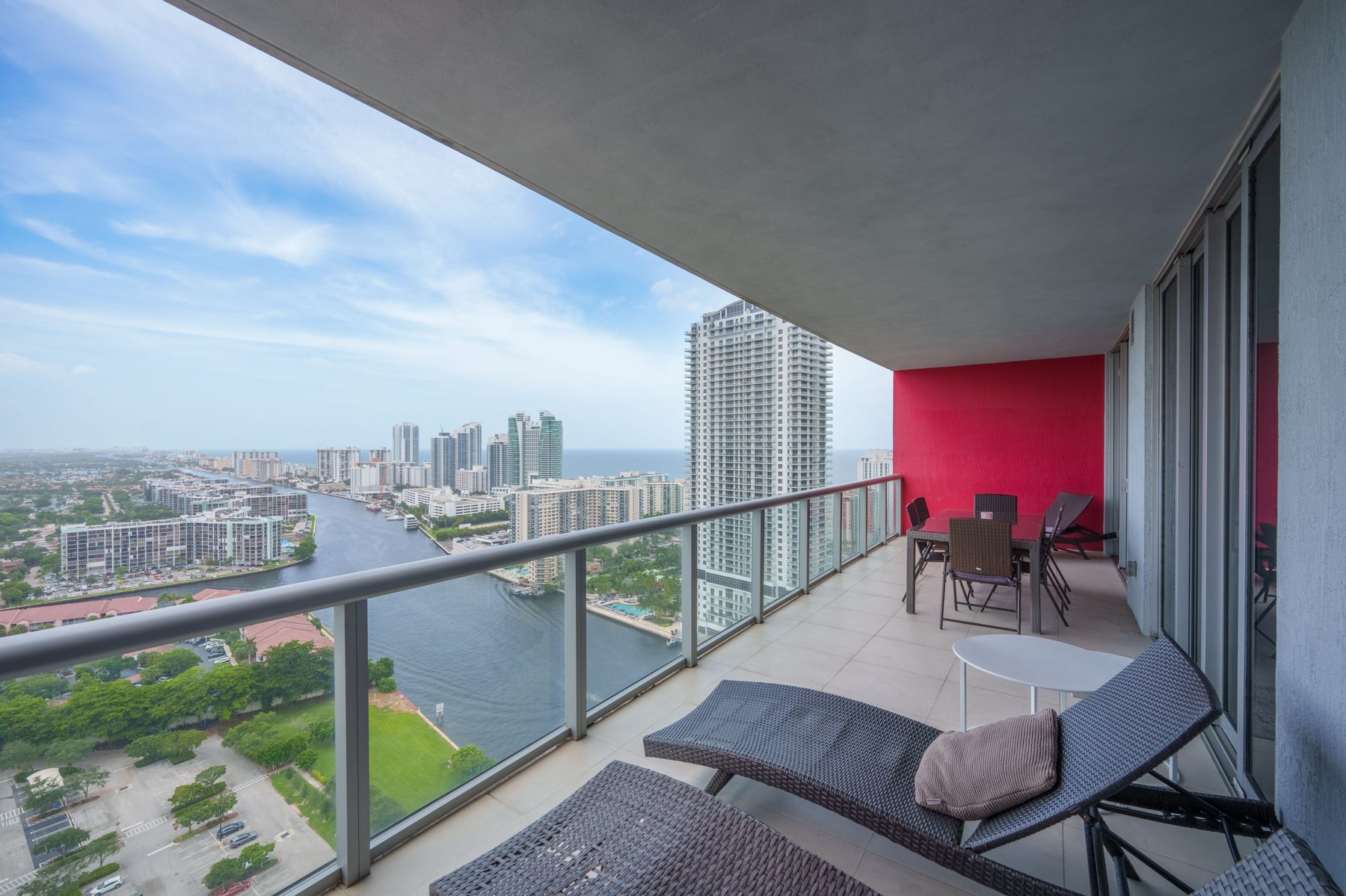 Balcony with lounge chairs and waterway view